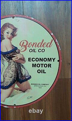 Old Vintage 1952 Bonded Oil Co. Pin Up Mancave Garage Bar Porcelain Sign 12 Inch