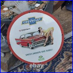 Vintage 1957 Chevrolet''Sweet, Smooth And Sassy'' Porcelain Gas & Oil Sign